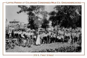 A postcard featuring Lottie Parish breaking ground at the Colorado Condensed Milk Co.  She is surrounded by a large community of people.